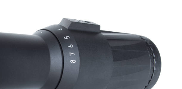 istock Magnification dial with a speed bump on a rifle scope isolated on white 1290513394