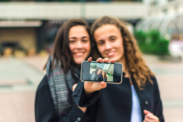 istock Female friends taking selfie 1290513471