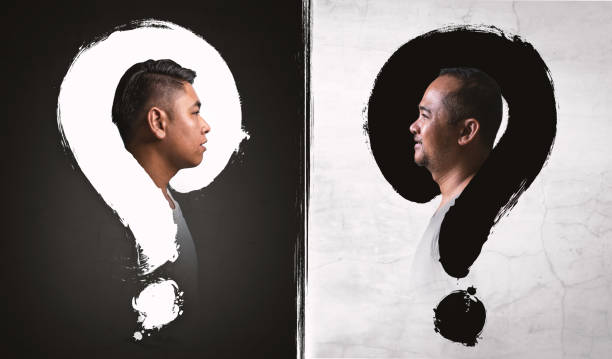 istock Man with question mark on a balck and white background 1290520959