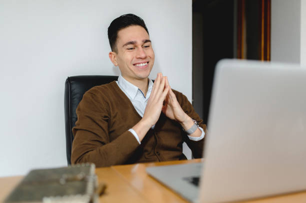 istock Man with smiling face working at computer laptop in office desk. 1290521833