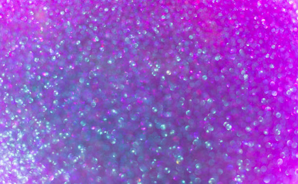 istock magical Christmas background, shiny purple glitter, blurred bokeh, defocused 1290524715