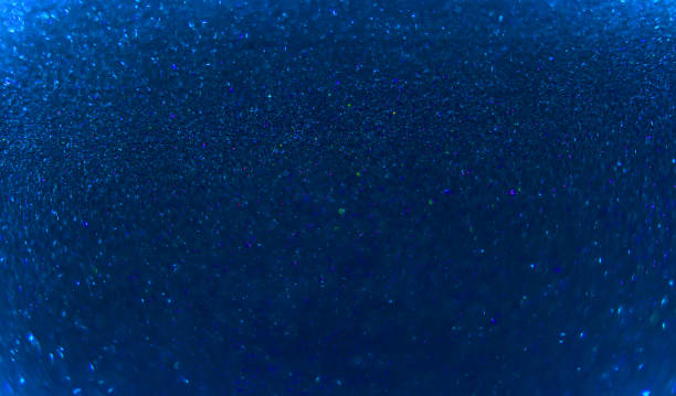 istock Christmas New Year background, shiny blue  glitter, blurred bokeh, defocused 1290525764