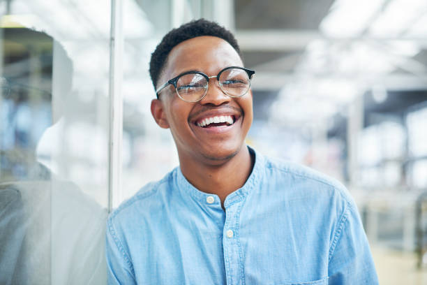 Be so good you become your own source of inspiration Portrait of a confident young businessman working in a modern office professional people laughing stock pictures, royalty-free photos & images