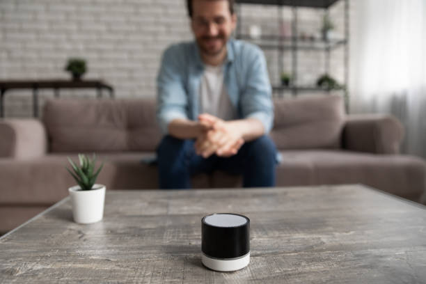 istock Happy young man looking at small digital portable assistant. 1290529122