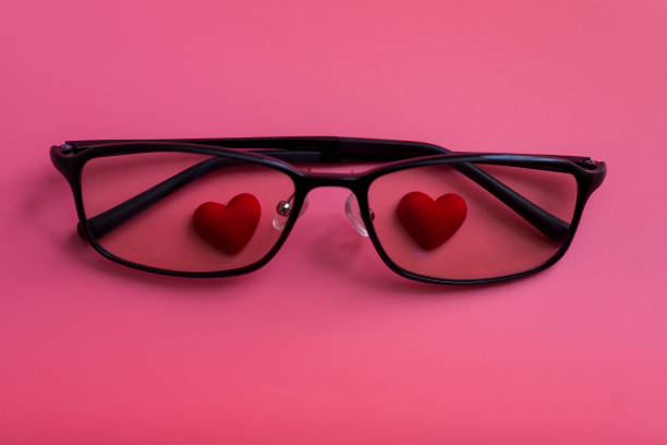istock Hearts in glasses on a pink background. 1290529157