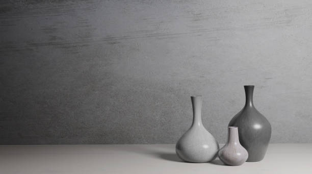istock Ceramic vase on the floor in the empty room with the cement wall background 1290535530