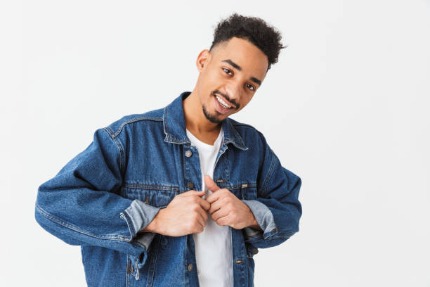 istock Smiling african man in denim jacket posing 1290535840