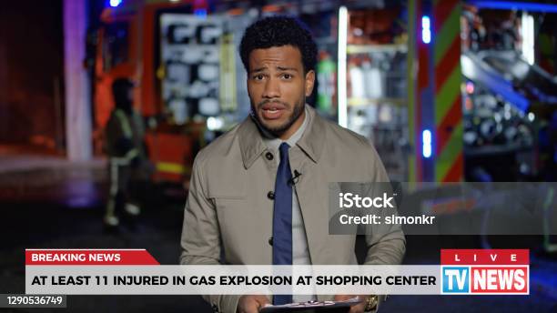 News Reporter Reporting On Gas Explosion Stock Photo - Download Image Now - Newscaster, Breaking News, Journalist