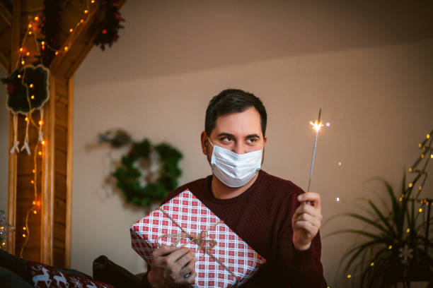 istock man celebrating new year alone during corona virus 1290537214