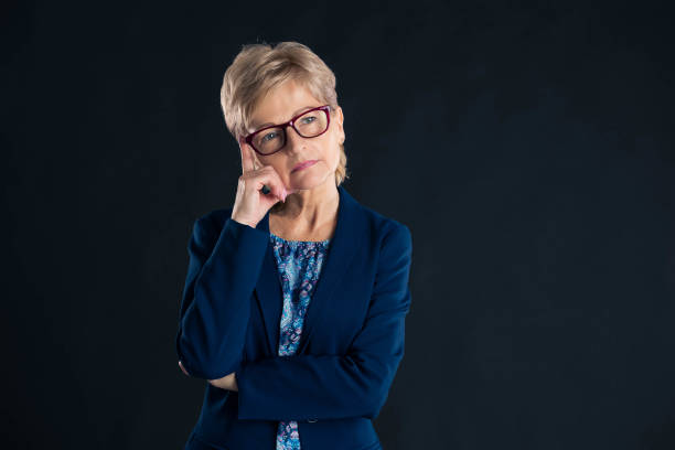 istock Older secretary thinking of something 1290538566
