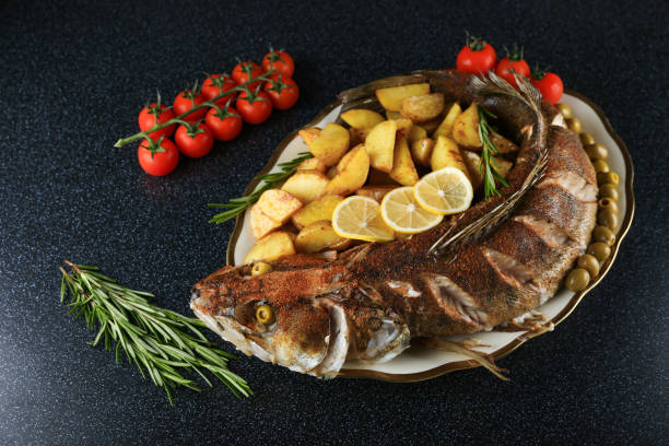 istock large baked fish is on a plate 1290540301