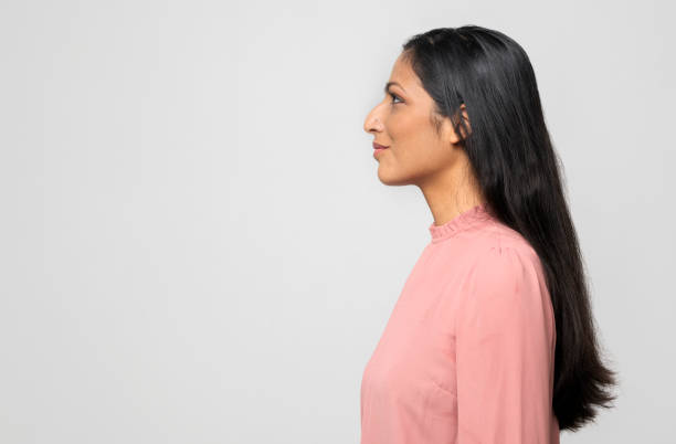 istock Profile of smiling young woman 1290544788