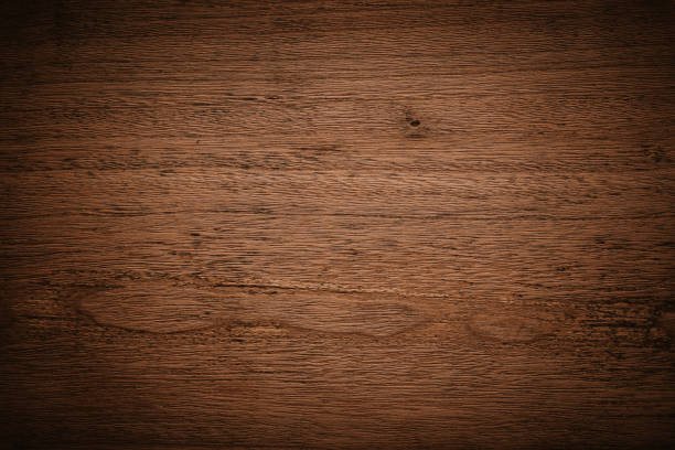 istock Dark brown wooden texture background 1290545289