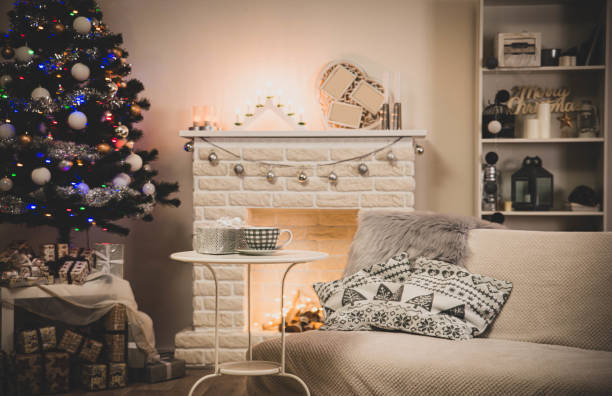 istock Cosy interior with a fireplace decorated in Christmas style 1290545319