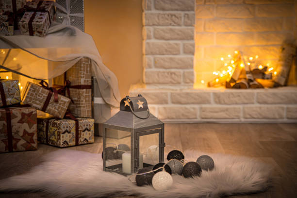 istock Cosy interior with a fireplace decorated in Christmas style 1290545335