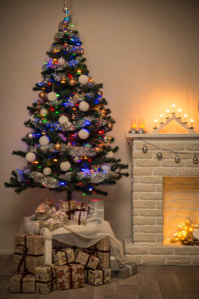 istock Cosy interior with a fireplace decorated in Christmas style 1290545341