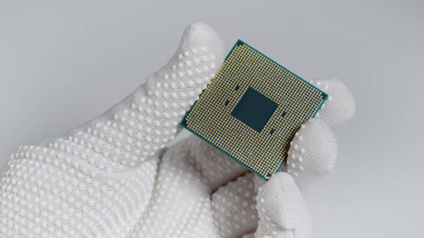 istock CPU. A laboratory technician holds a powerful processor in his hands. A group of scientists is working in the field of artificial intelligence 1290545418