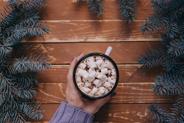 istock Female hand with mug of hot drink. 1290546397