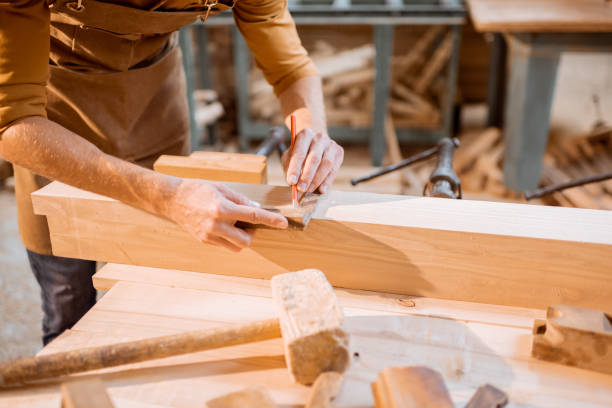 istock Carpenter working with a wood indoors 1290546580