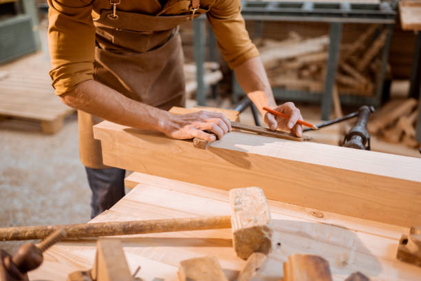 istock Carpenter working with a wood indoors 1290546597