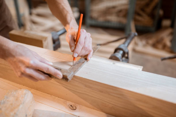 istock Carpenter working with a wood indoors 1290546641