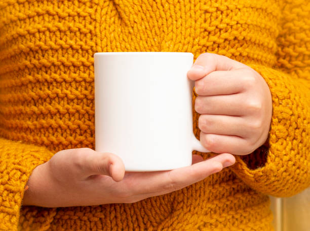 istock Girl is holding white cup 1290546729