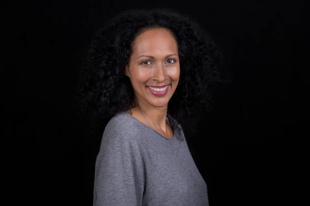 istock Smiling mid adult woman 1290546742