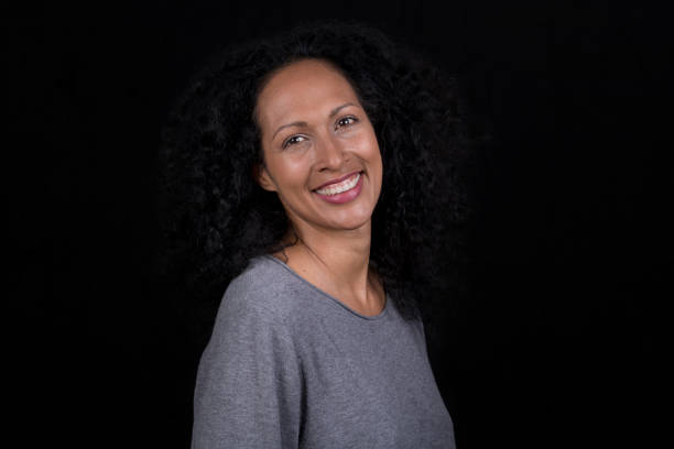 istock Smiling mid adult woman 1290546781