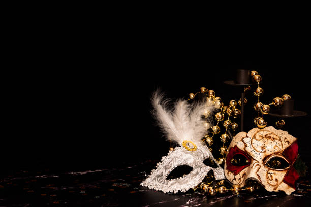 istock Venetian masks for carnival on a black background 1290546934