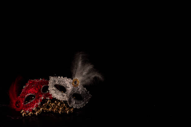 istock Venetian masks for carnival on a black background 1290546944