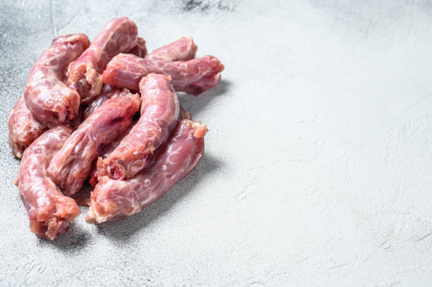 istock Raw fresh chicken neck meat. Gray background. Top view. Copy space 1290549299