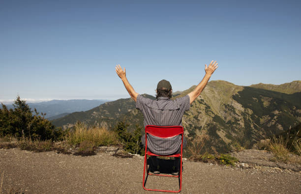 Man relaxing at mountain during covid-19 pandemic.