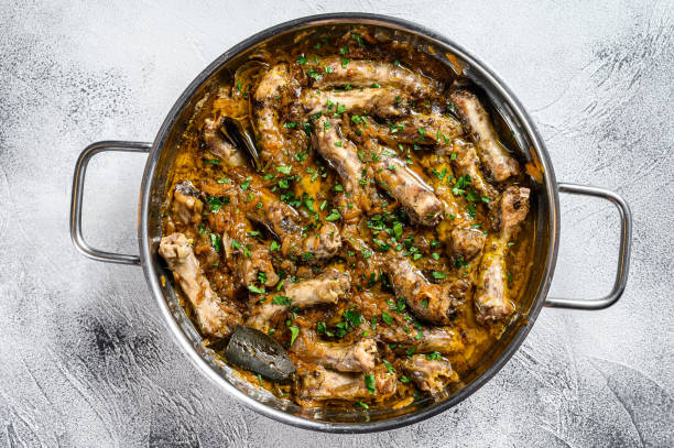 istock Fried Chicken Necks with vegetables. Gray background. Top view 1290549824