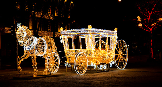 Wiesbaden, Germany,12/07/2020: Illuminated royal horse and cart at the Wiesbaden Christmas Market, Luisenplatz, Germany