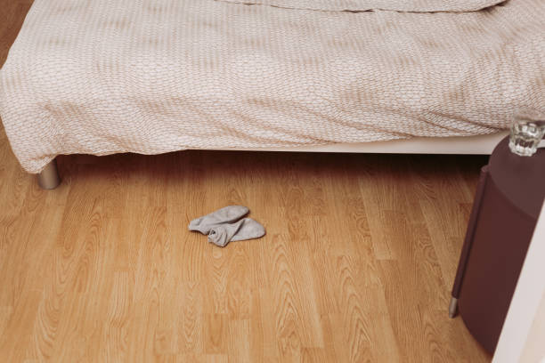istock Dirty socks on bedroom floor 1290552178