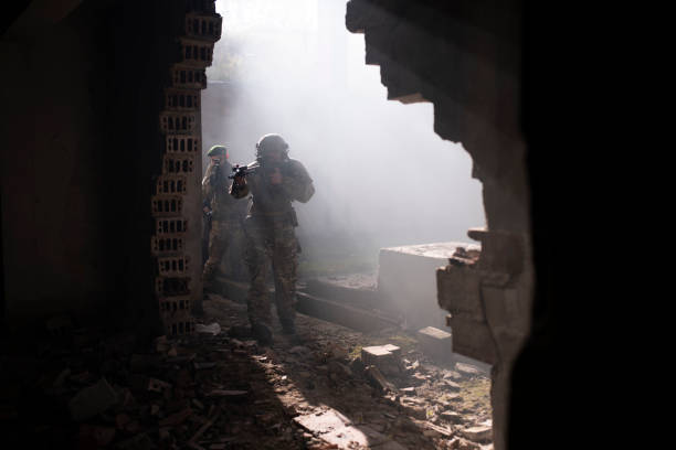 istock Group of soldiers in attacking position. 1290553535