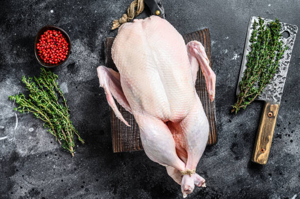 istock Raw whole duck, poultry meat. Black background. Top view 1290553650