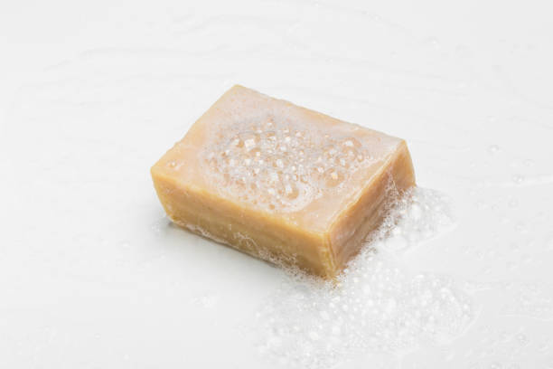 istock Soap bar and foam on white background, top view. Mockup for design 1290559007