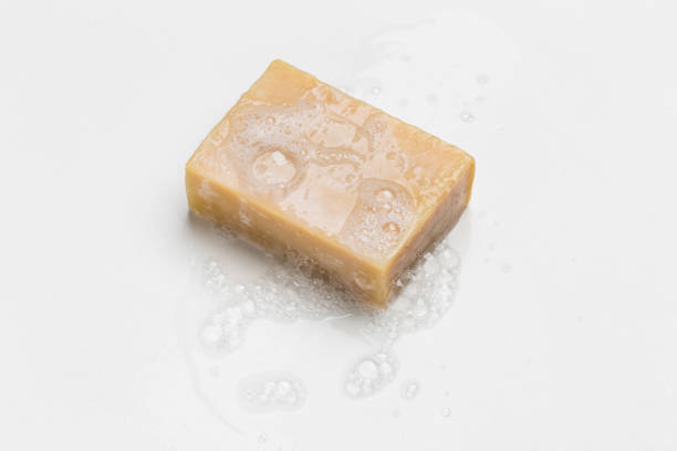 istock Soap bar and foam on white background, top view. Mockup for design 1290559565