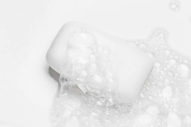 istock Soap bar and foam on white background, top view. Mockup for design 1290559569