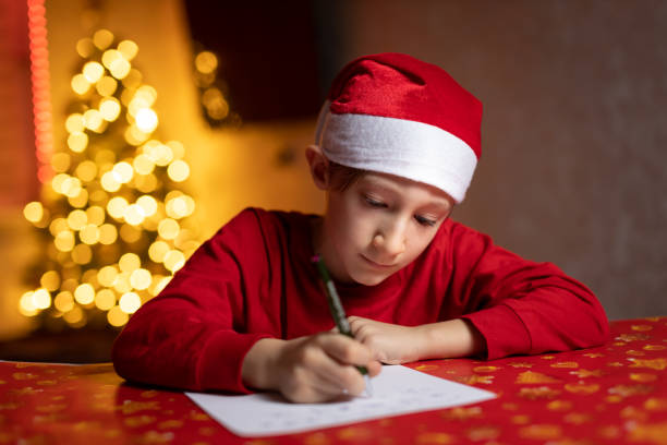 istock a child writes a letter to Santa Claus 1290559874