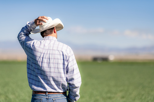 Rear view of a farmer on a ranch in Utah.