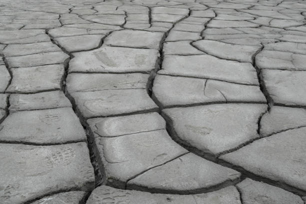 istock Earth ground crack with rough dry surface texture. Climate change and drought impact. 1290566810