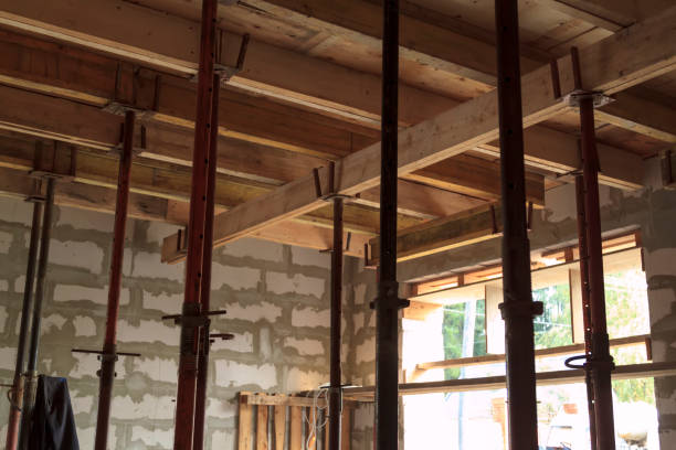 istock view of wooden formwork with metallic holders, which will be filled with overlap between floors in country house under construction from foam block 1290567552