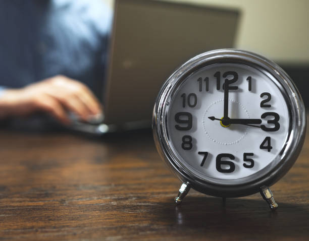 istock The clock shows three o'clock in the afternoon. Working hours are in full swing. 1290568898