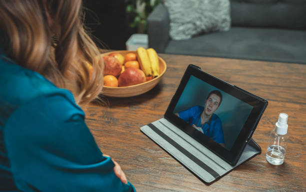istock Woman making video call with her doctor. 1290568912