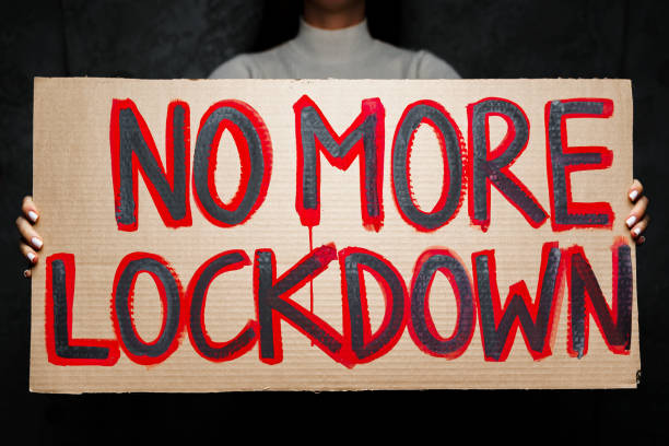 istock Protestive placard against coronavirus lockdowns against wall 1290573730