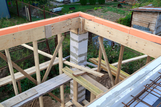 istock view of wooden formwork with holders, which will be filled with overlap between floors in country house under construction from foam block 1290575138