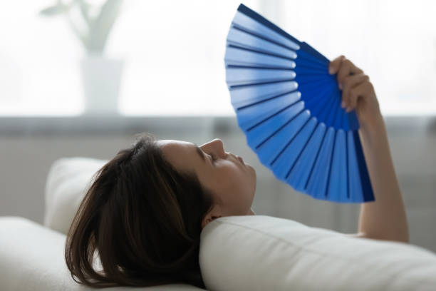 istock Young woman rest on couch using waver 1290577505