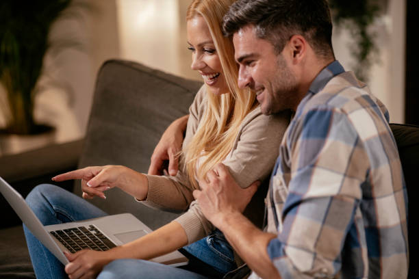 istock Happy couple purchasing online from home 1290577818